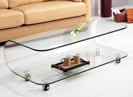 Bent glass coffee table on casters